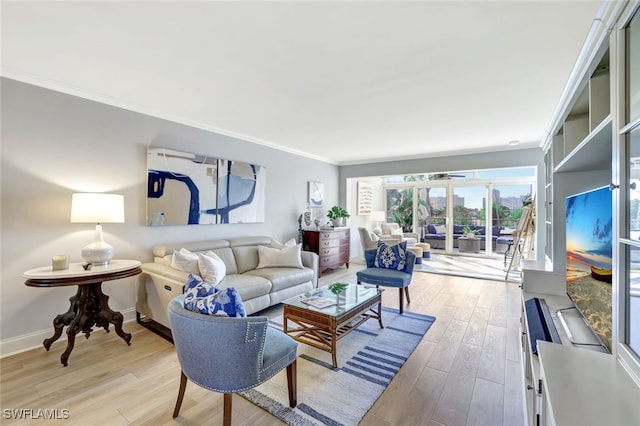 living room featuring ornamental molding and light wood-type flooring