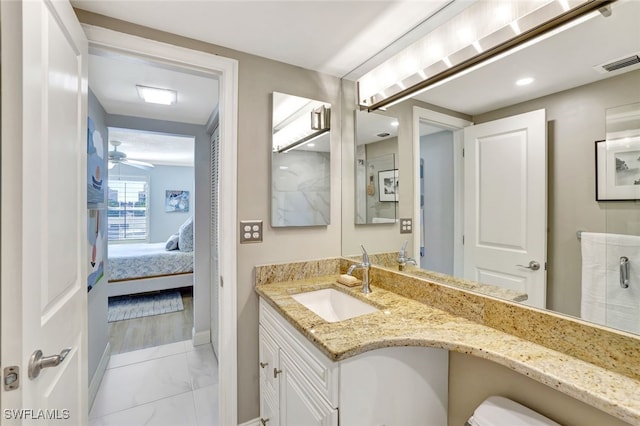 bathroom featuring vanity and ceiling fan