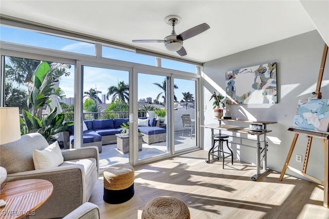 sunroom / solarium with ceiling fan