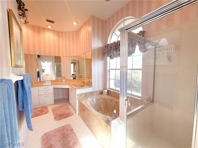 bathroom with vanity, tile patterned flooring, and shower with separate bathtub