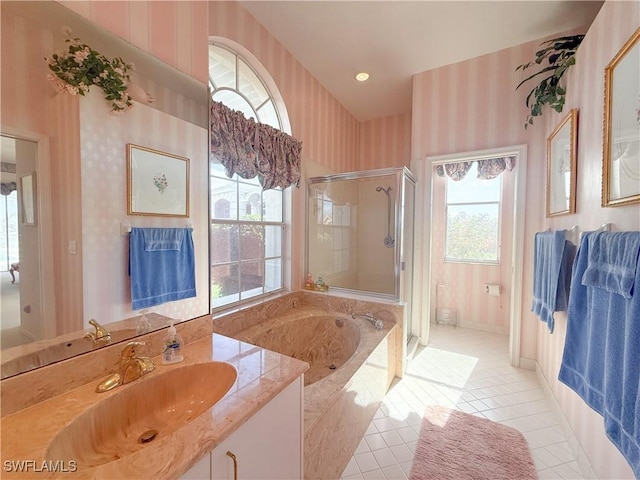 bathroom featuring vanity, a fireplace, tile patterned floors, and shower with separate bathtub