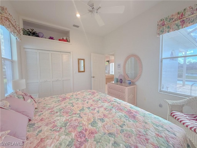 bedroom featuring multiple windows, a closet, and ceiling fan