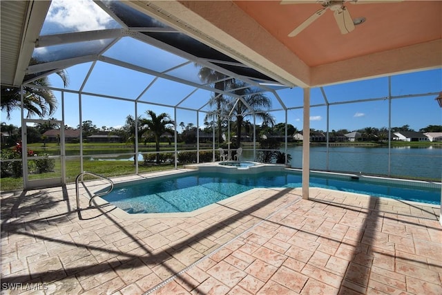 view of swimming pool featuring a water view, an in ground hot tub, a lanai, and a patio area