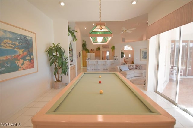 rec room featuring light tile patterned flooring, plenty of natural light, ceiling fan, and billiards