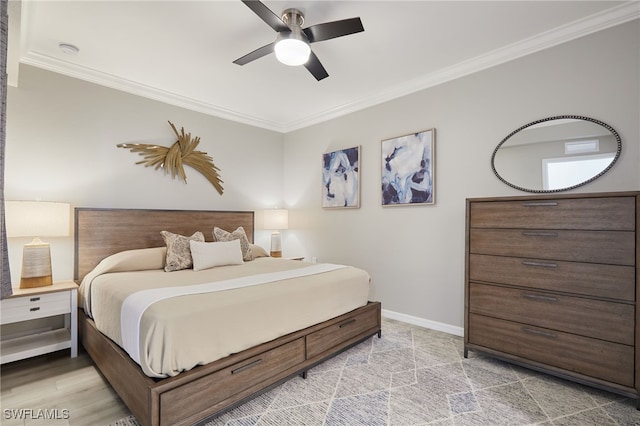 bedroom with ornamental molding and ceiling fan