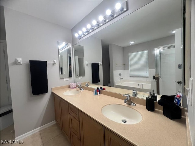 full bathroom with a garden tub, a shower stall, double vanity, tile patterned flooring, and baseboards