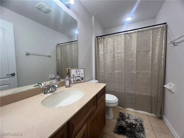 bathroom with tile patterned floors, toilet, vanity, and a shower with curtain