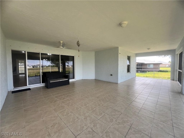 view of patio featuring ceiling fan
