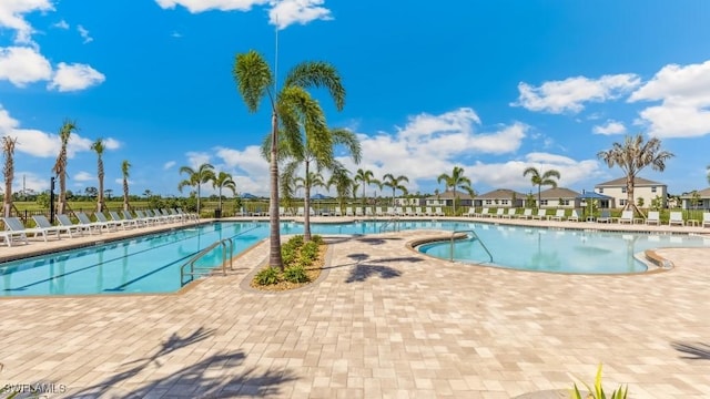 2609 Table Coral Trl, North Fort Myers, FL 33903 - community pool featuring a patio