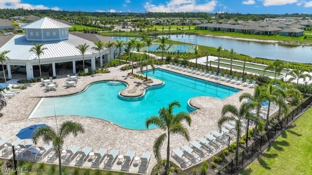 2609 Table Coral Trl, North Fort Myers, FL 33903 - community pool featuring a patio, a residential view, and a water view