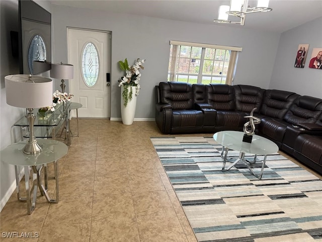 living room with an inviting chandelier and light tile patterned floors