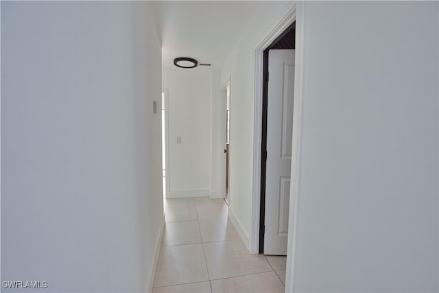 hallway featuring light tile patterned floors