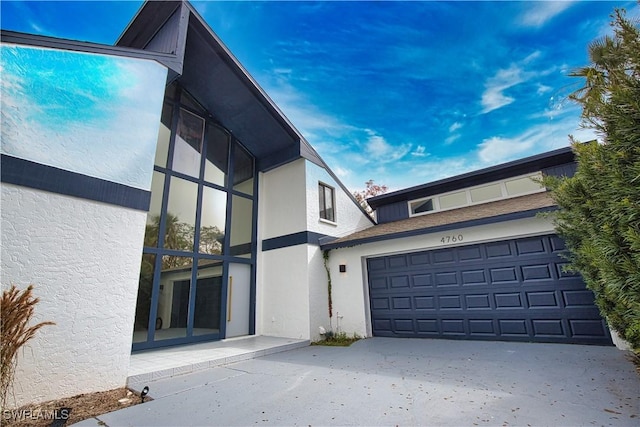 view of side of home with a garage