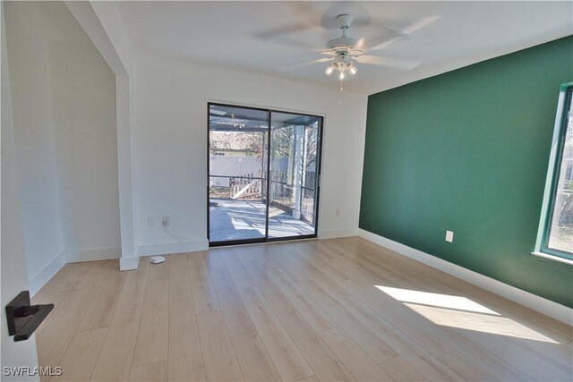 unfurnished room featuring light hardwood / wood-style flooring and ceiling fan