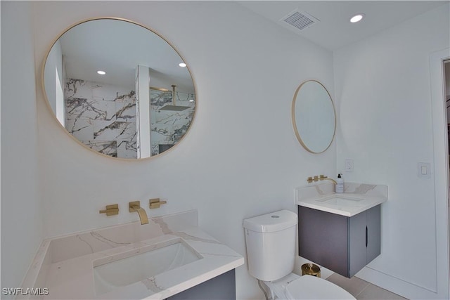 bathroom featuring vanity, a shower, and toilet