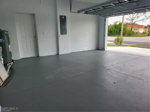 garage with electric panel and water heater