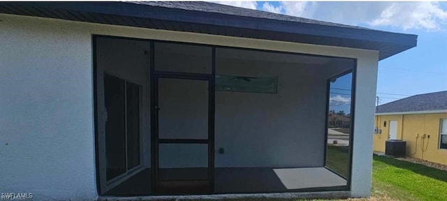 entrance to property with central AC unit