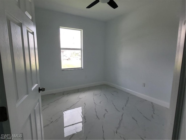 spare room featuring ceiling fan