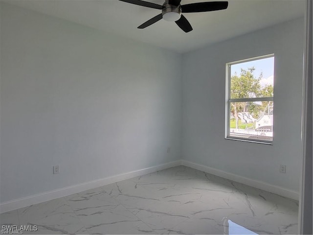 unfurnished room with ceiling fan