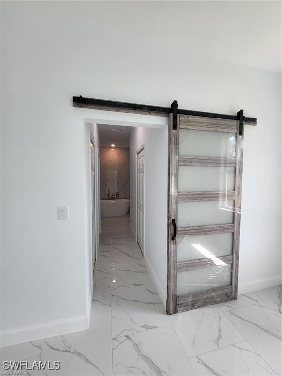 hallway with a barn door