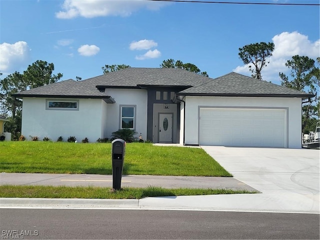 view of front of home featuring a garage and a front lawn