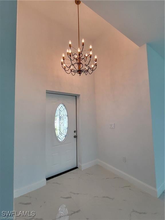 entryway with a notable chandelier