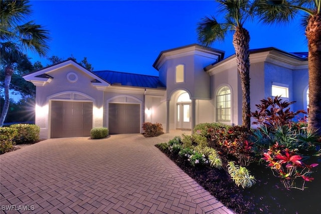 mediterranean / spanish-style home featuring a garage