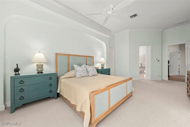 carpeted bedroom with ornamental molding, ceiling fan, and ensuite bathroom