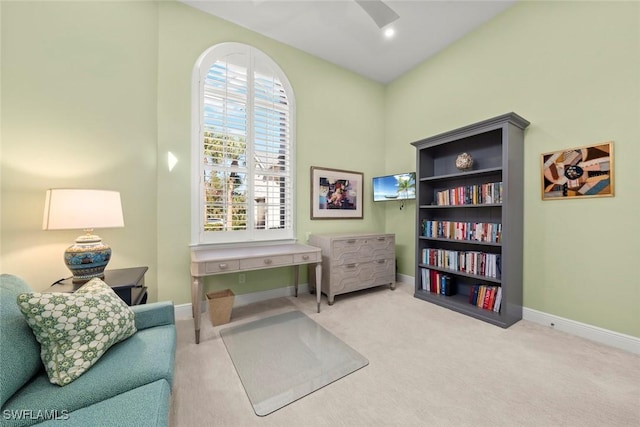 sitting room featuring ceiling fan and carpet