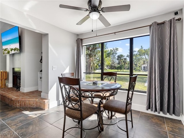 dining space with plenty of natural light and ceiling fan