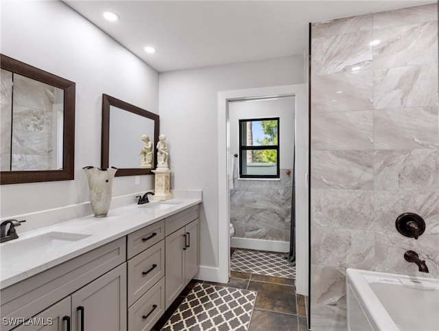 full bathroom featuring independent shower and bath, vanity, tile walls, and toilet