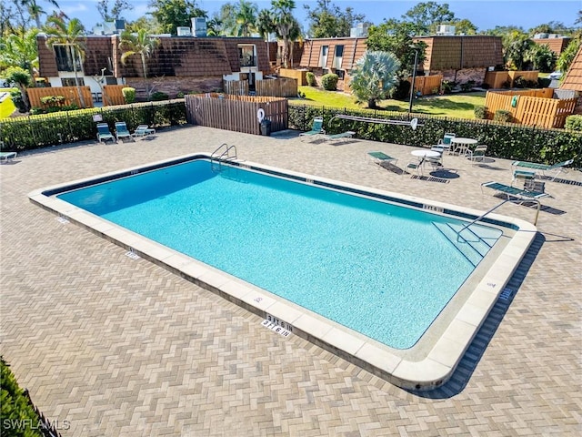 view of pool featuring a patio