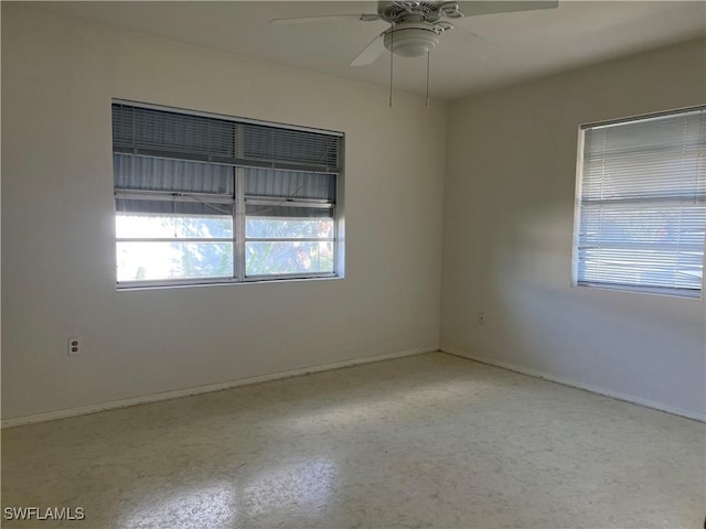 unfurnished room with ceiling fan