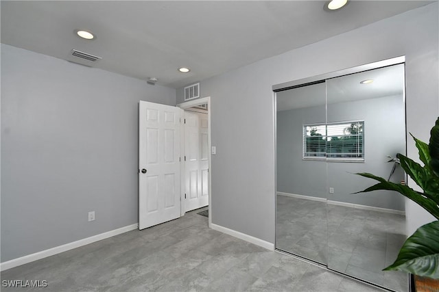 unfurnished bedroom featuring a closet