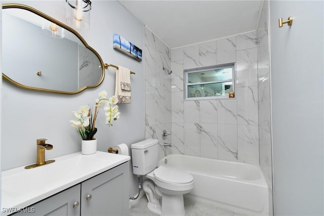 full bathroom with vanity, tiled shower / bath combo, and toilet