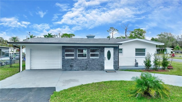 single story home with a garage and a front lawn