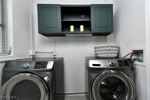 laundry room with independent washer and dryer