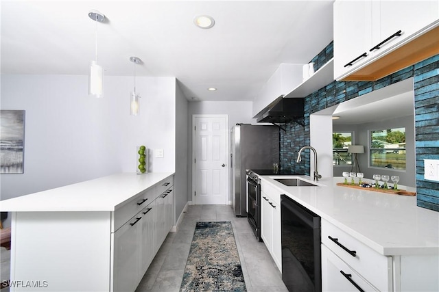 kitchen featuring white cabinetry, sink, beverage cooler, decorative backsplash, and hanging light fixtures