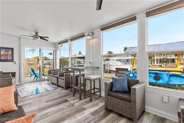 sunroom / solarium with ceiling fan