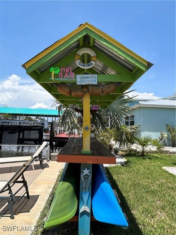 2622 Bridgeview St, Matlacha, FL 33993 - view of home's community featuring a boat dock, a water view, and boat lift