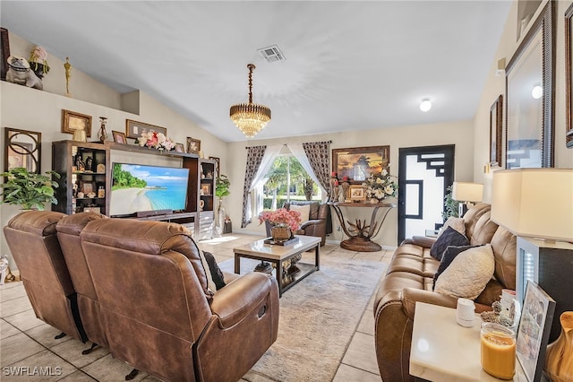 tiled living room with an inviting chandelier and vaulted ceiling