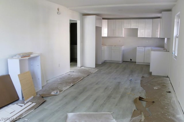 16881 Davis Rd Unit 712, Fort Myers, FL 33908 - kitchen featuring white cabinetry and light wood-type flooring
