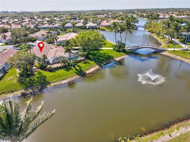 aerial view featuring a residential view and a water view