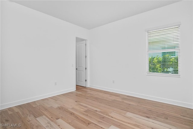 unfurnished room with light hardwood / wood-style flooring