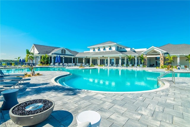 view of swimming pool with a patio