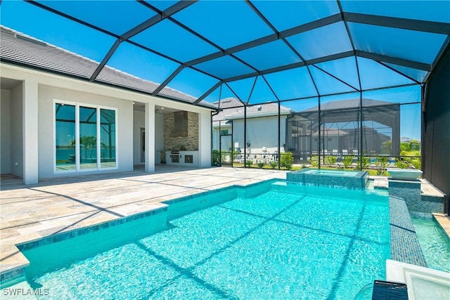 view of pool with a patio and a lanai