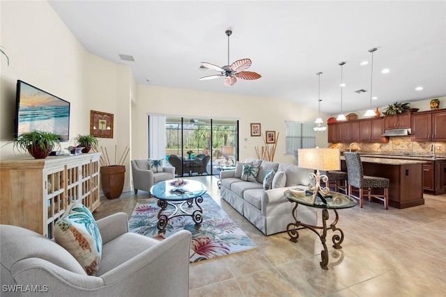 tiled living room featuring ceiling fan