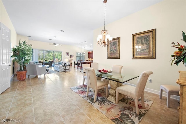 tiled dining room featuring ceiling fan with notable chandelier