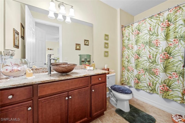 full bathroom with tile patterned floors, toilet, vanity, and shower / bath combo