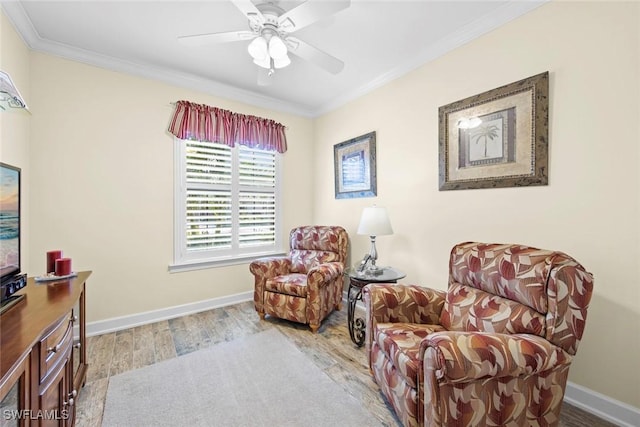 living area featuring crown molding, light hardwood / wood-style flooring, and ceiling fan